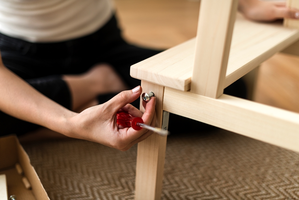 woman assembling diy chair from scratch